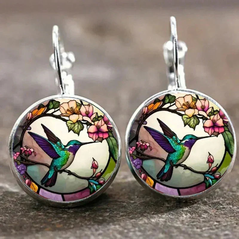 Hummingbird pendant necklace under a glass dome
